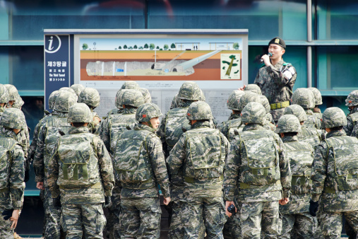 Paju, South Korea - March 15, 2014: a group of soldiers of Republic of Korea Marine Corps, listen the story of the 3rd Tunnel of Aggression from a militray leader. Site of the 3rd Tunnel of Aggression site.