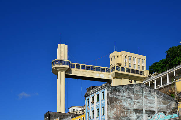 Salvador, Bahia - Lacerda elevator from below Lacerda elevator - links Cairu Square, Lower Town and Thome de Souza Square, in the Upper Town - seen from Cidade Baixa - deep blue sky with copy space - photo by M.Torres lacerda elevator stock pictures, royalty-free photos & images