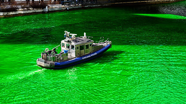 istock Chicago police boat on green River, Saint Patricks Day 481129765