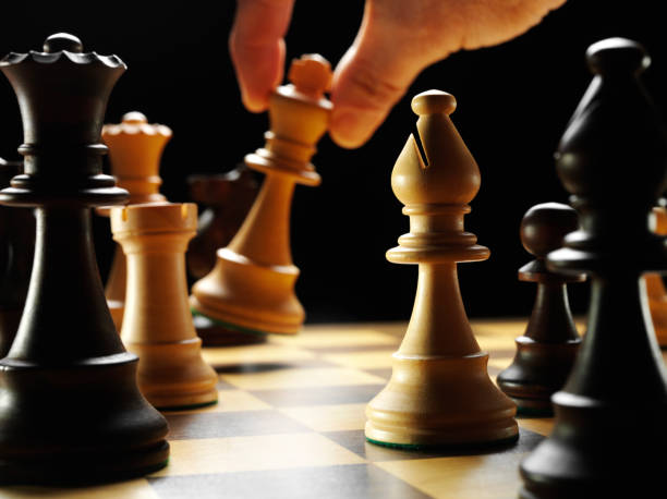 istock Holding the King in a Game of Chess 481130767