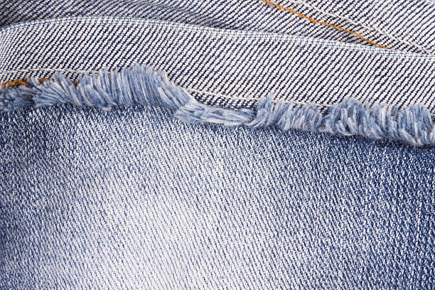 istock close up of blue jeans fringe 481130874