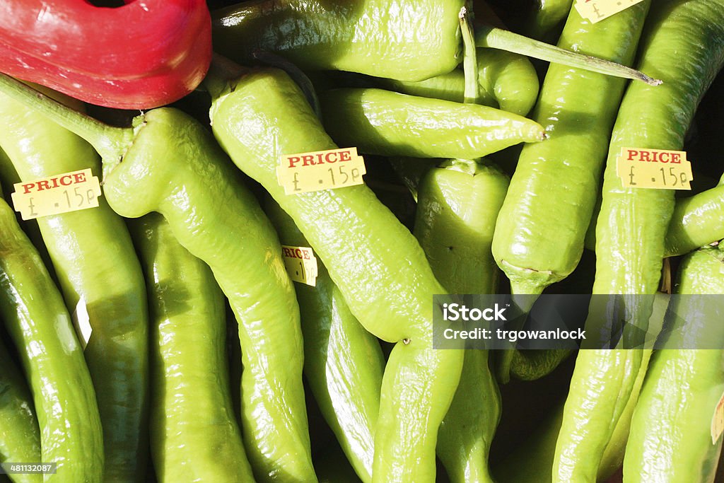 Green jalpeno peppers Fresh green jalapeno peppers at a UK market stall with prices Collection Stock Photo