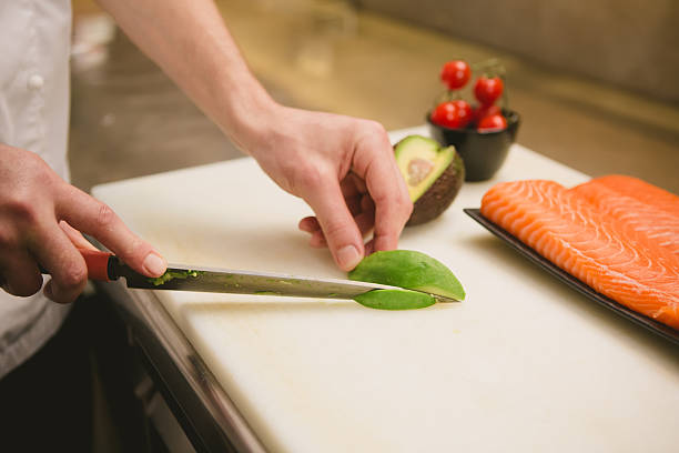 istock Cutting the salmon with a knife 481137256