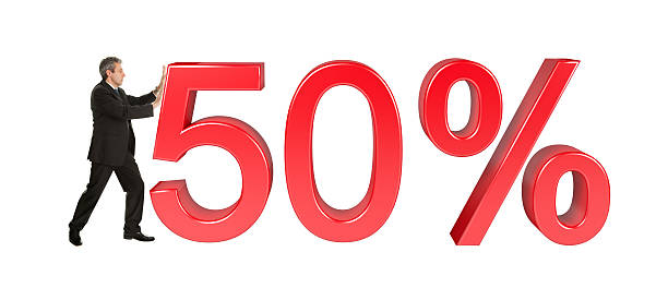 istock Businessman pushing 50% sale sign 481140800