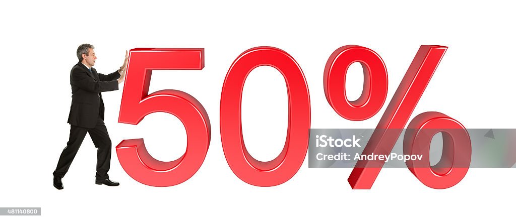 Businessman pushing 50% sale sign Businessman pushing 50% sale sign. Isolated on white background 2015 Stock Photo