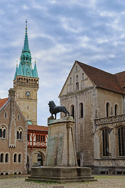 istock Square near Braunschweig cathedral with lion statue 481147918