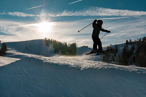 istock Little skier performs jump in the snow 481152264