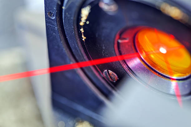 Red laser in laboratory Red laser on optical table in physics laboratory photon stock pictures, royalty-free photos & images
