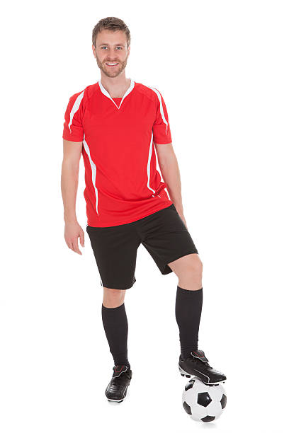 istock Confident Player With Leg On Soccer Ball 481160826