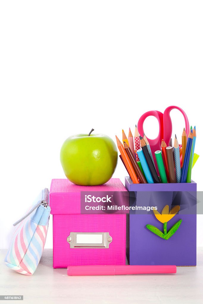 Back to School or Education Concept Back to School or Education Concept with classroom desk and bright colored stationery supplies on white wood rustic table. 2015 Stock Photo