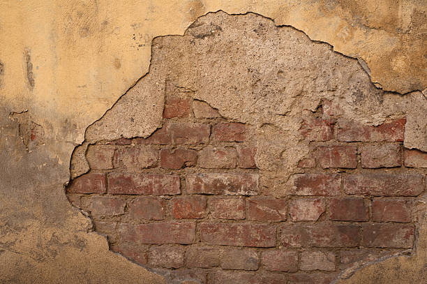 istock Texture of old wall covered with yellow stucco 481166826