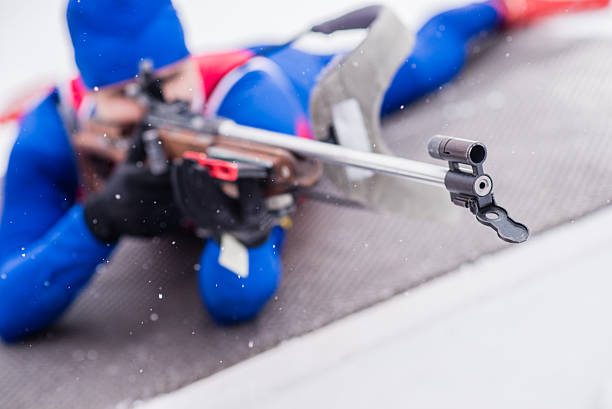 istock Athletic man with biathlon rifle 481169982