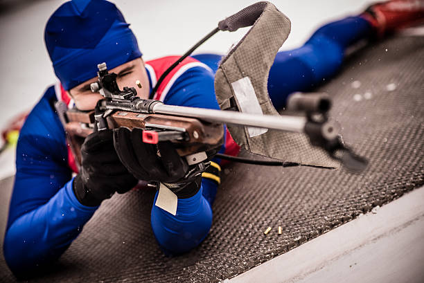 istock Athletic man with biathlon rifle 481170088