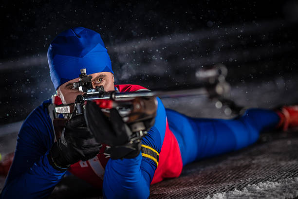 istock Athletic man with biathlon rifle 481170136