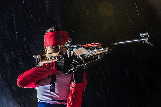 istock Athletic woman with biathlon rifle 481170184