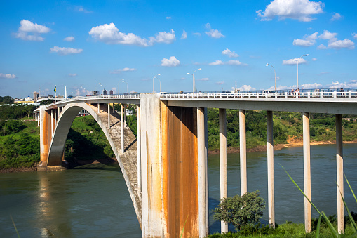 Ciudad del Este, Paraguay - May 6, 2015: View of the Friendship Bridge (Ponte da Amizade) over the Parana river, connecting Foz do Iguacu, Brazil, to Ciudad del Este in Paraguay.