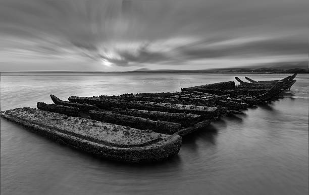 istock asian shipwreck at seaside black and white tone. 481171494