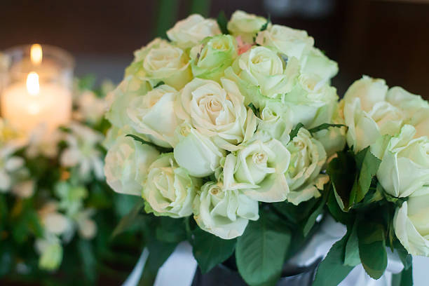 istock Candle and Wedding bouquet of white roses 481172046