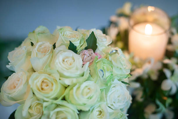istock Candle and Wedding bouquet of white roses 481172338