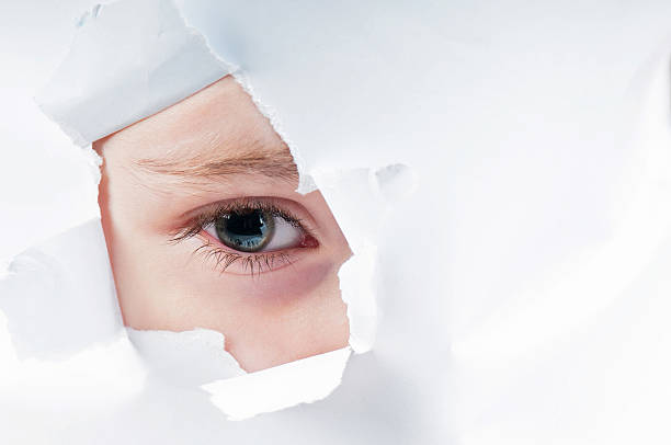 istock Cute baby girl looking through paper hole 481174746