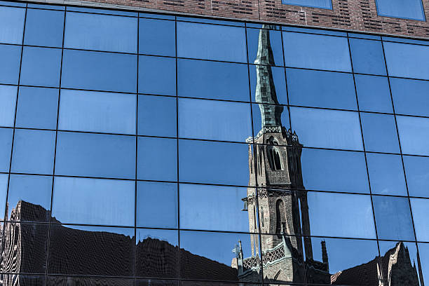 istock Old cathedral reflected on the glass building facade 481177958