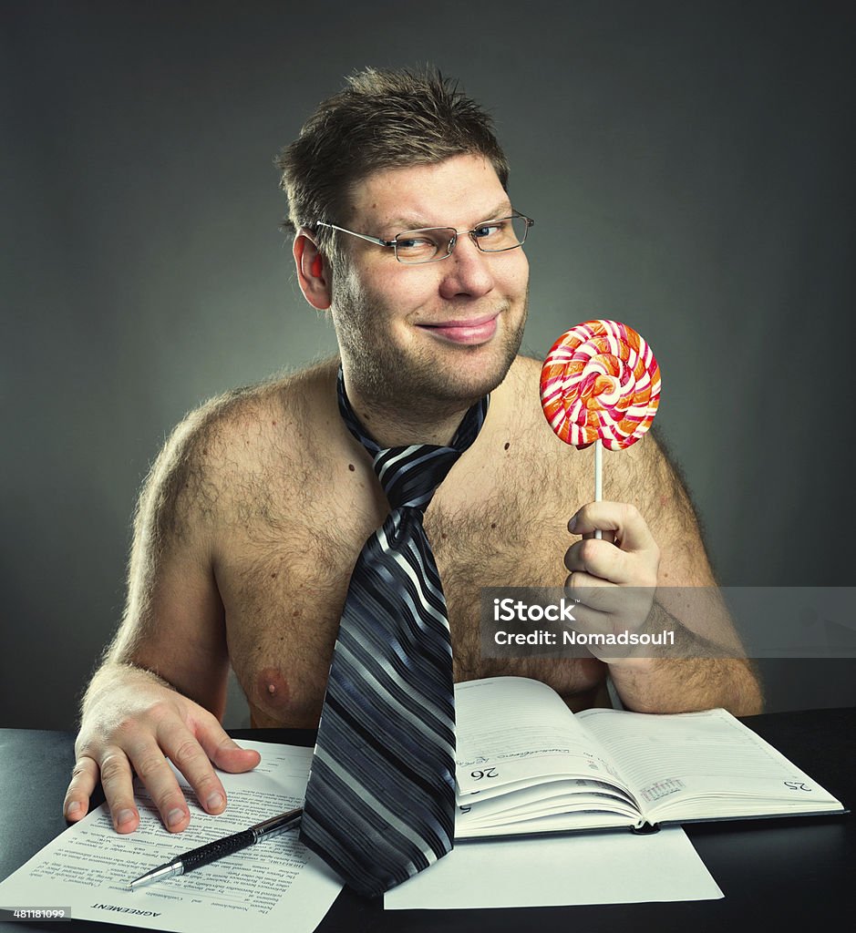 Shirtless businessman Shirtless businessman with big lollipop Flasher - Criminal Stock Photo