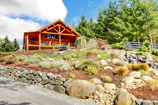 istock Log cabin home on the hill with waterfall and flowers. 481181141