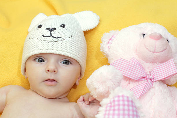 istock baby with a teddy bear Mishutka 481181360