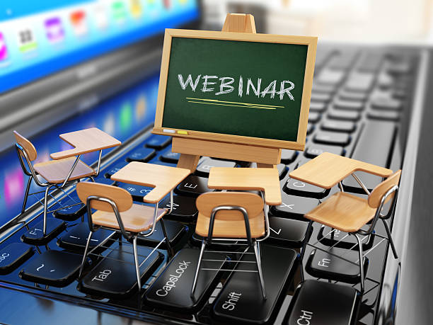 istock Webinar concept. Schooldesk and chalkboard on the laptop keyboar 481183020