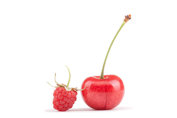 istock Raspberries and cherries on a white background. 481183780