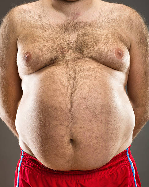 Fat man cropped view Fat man cropped front view fat guy no shirt stock pictures, royalty-free photos & images