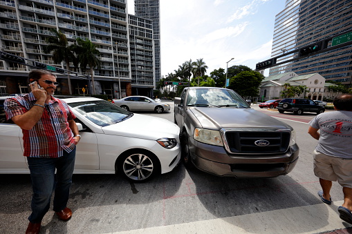 Miami, USA - July 14, 2015: Stock image of a vehicle collision between a car and truck on Brickell Avenue and 5th Street. 