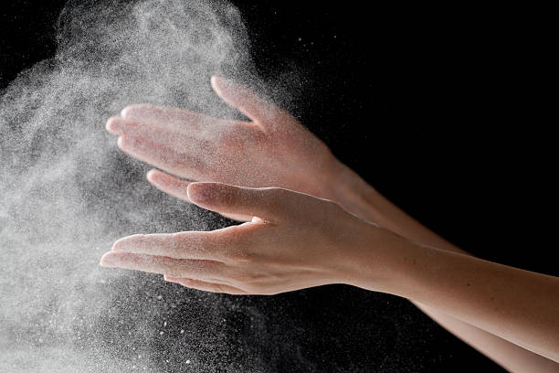 istock woman coating her hands in powder chalk magnesium 481187722