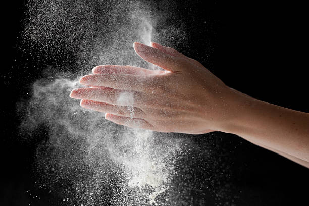 istock woman coating her hands in powder chalk magnesium 481187728