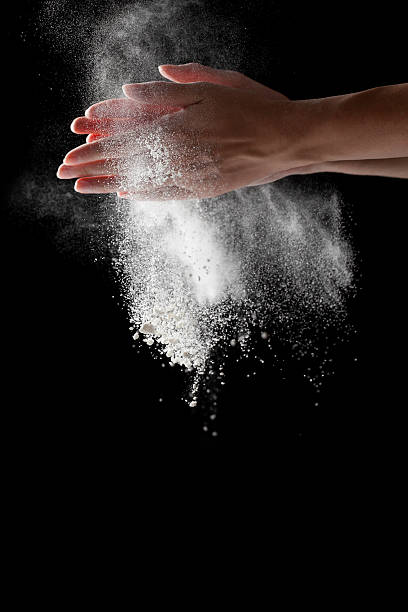 istock woman coating her hands in powder chalk magnesium 481187732