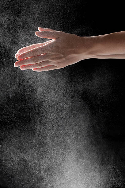 istock woman coating her hands in powder chalk magnesium 481187734