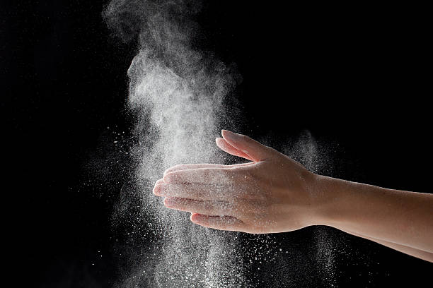 istock woman coating her hands in powder chalk magnesium 481188040