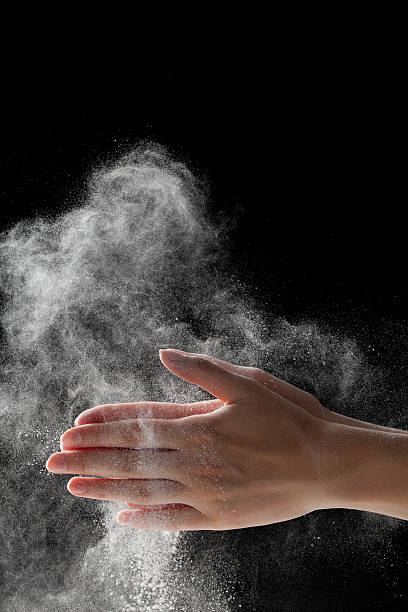 istock woman coating her hands in powder chalk magnesium 481188248