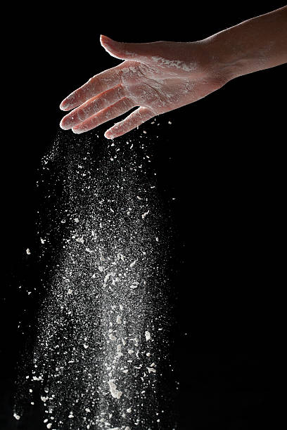 istock woman coating her hands in powder chalk magnesium 481188274