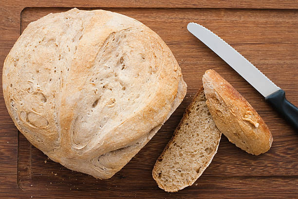 istock knife and home made bread on wooden board 481189490