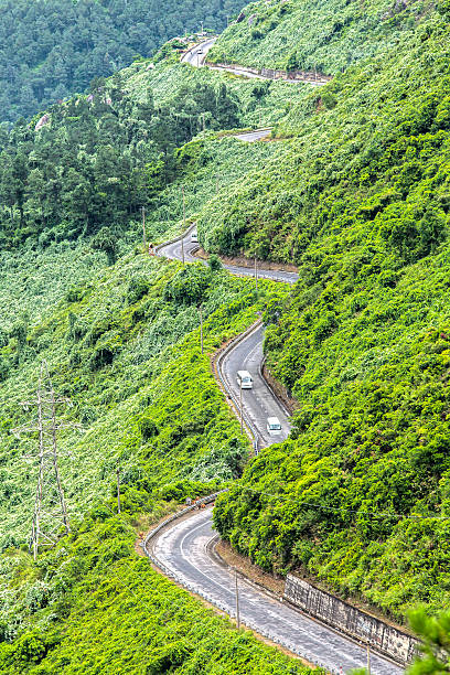 Two Van Passes Hai Van Pass road with the same street as the snake winding around the mountain creating spectacular beauty of nature in central Vietnam. maloja region stock pictures, royalty-free photos & images