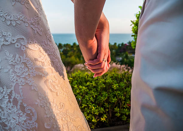 istock hands of a young couple with a ring 481189863