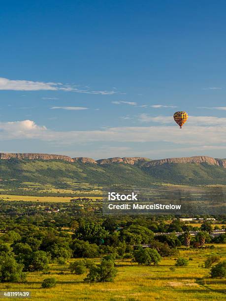 Hot Air Balloon In Front Of Magaliesberg Mountains Stock Photo - Download Image Now - South Africa, Johannesburg, Safari