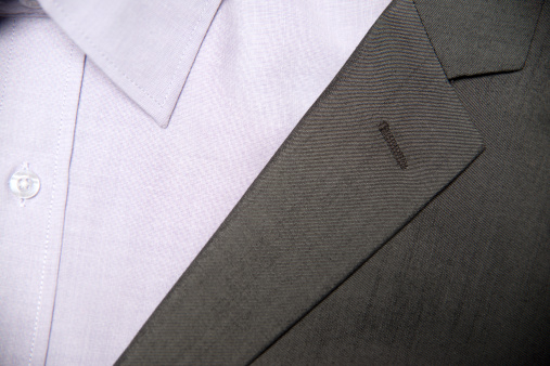 Close-up of a shirt and jacket lapel.