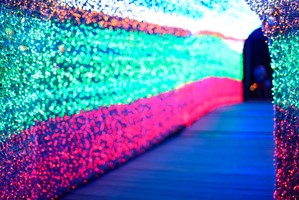 istock De-focused Christmas Light-colored walkway tunnel. 481194216