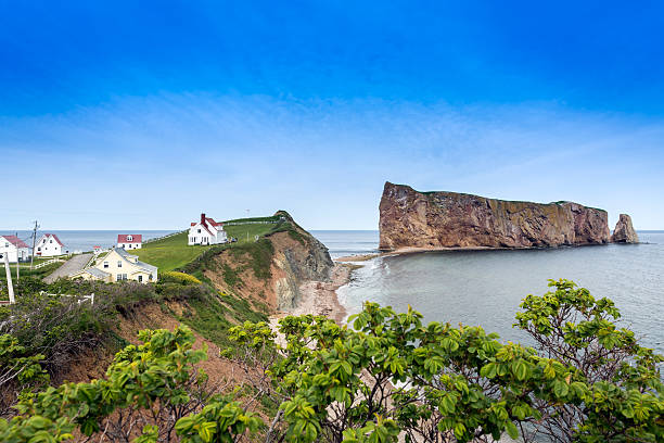 Perce Rock in Perce, Quebec Canada Perce rock is a huge sheer rock formation in the Gulf of Saint Lawrence on the tip of the Gaspe Peninsula in Quebec, Canada. gulf of st lawrence photos stock pictures, royalty-free photos & images