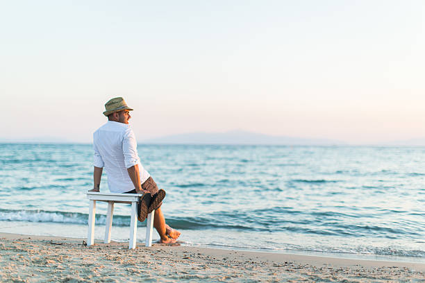 istock Man enjoying the sea breeze and sun 481197294