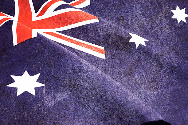 Grunge distressed aged old Australian flag for Anzac Day, 70th anniversary WWII, or 100th anniversary start of WWI events.