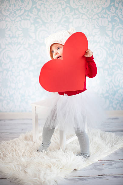 Little girl holding a heart