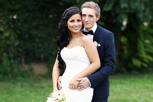 istock Beautiful bridal couple embracing 481204094